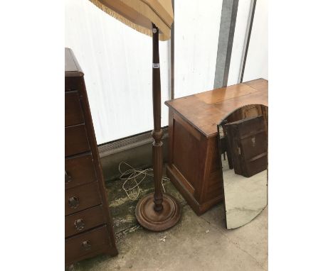 A CARVED MAHOGANY STANDARD LAMP 
