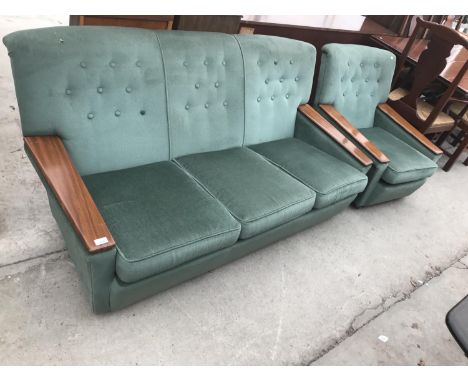 A RETRO THREE SEATER SOFA WITH TEAK ARMRESTS AND A MATCHING ARMCHAIR 
