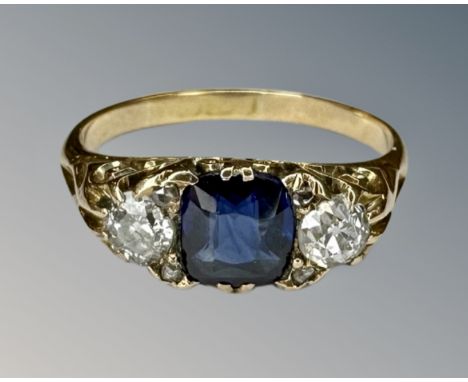 An antique sapphire and two stone diamond ring on yellow gold shank, size L. CONDITION REPORT: Central sapphire approximately