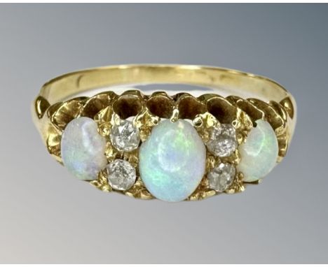 An antique 18ct gold opal and diamond ring, size N.