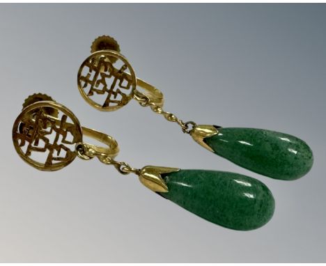 A pair of 14ct yellow gold Chinese jade earrings (2) CONDITION REPORT: Screw post fittings, drop length 2 cm.