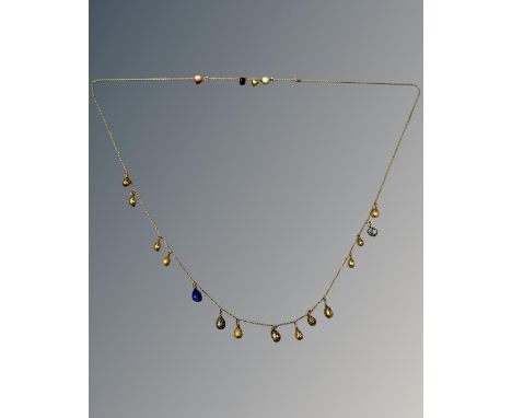 A fine early 20th century Russian enamel and gem set egg pendant necklace, the yellow gold chain links supporting nineteen eg