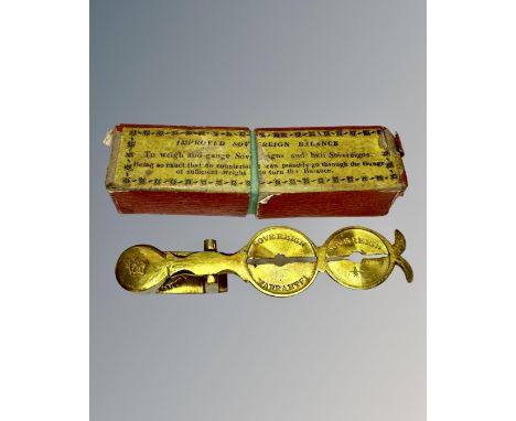 A set of antique sovereign scales in original box.