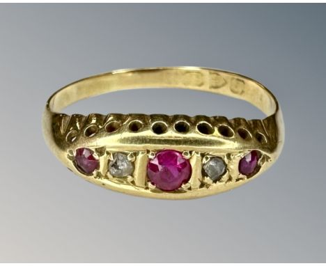 An 18ct yellow gold ruby and diamond ring, size P.