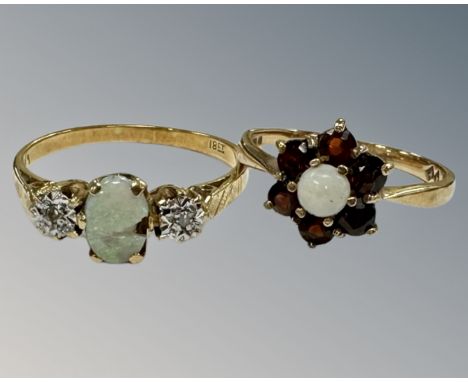 A 9ct yellow gold opal and garnet cluster ring, L, 1.6g, together with an 18ct gold opal and two stone diamond ring (af), P, 