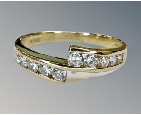 An 18ct gold ten stone diamond ring, size N½, approximately 0.5ct of diamonds.