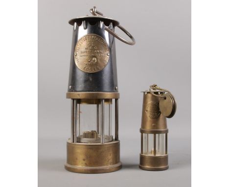 Two Protector Lamp &amp; Lighting Co Ltd safety miners lamps.  