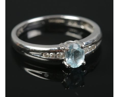 A 9ct white gold aquamarine &amp; diamond ring. Size K. 2g.  