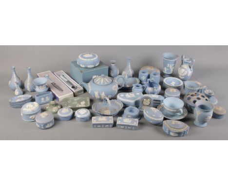 A large quantity of mostly blue Wedgwood Jasperware. Including teapot, trinket dishes, vases, clock, etc.  