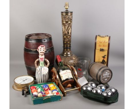 An assortment of miscellaneous. To include a bottle of brandy mounted on a wooden cannon and a large decorative lamp etc.  La