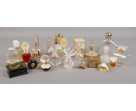 Lot - A collection of twenty-four Lalique miniature perfume bottles