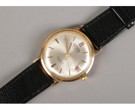 A Vintage Trident Gents automatic wristwatch, with silvered dial, baton markers and date window. 25 jewel incabloc movement o