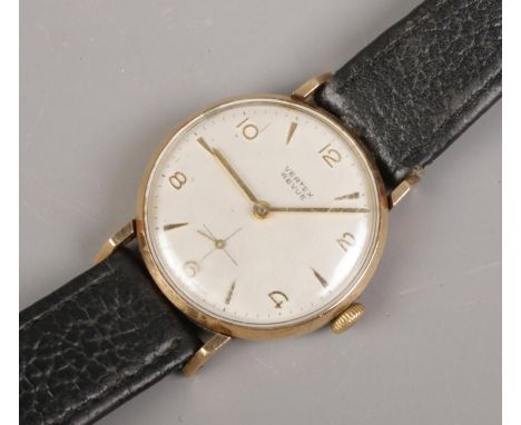 A Gent's Vertex Revue manual wind wristwatch, with 9ct Gold back. Silvered dial, with arabic numerals and baton markers on bl