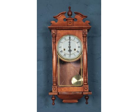 A Mahogany Lincoln 31 day cased wall clock. Comes with key and pendulum.  Will need attention.