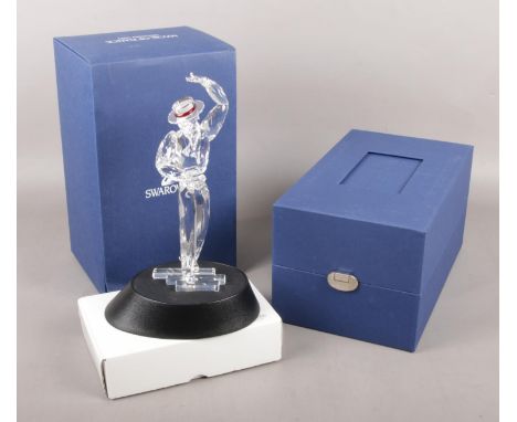 A boxed Swarovski Magic of Dance figure with stand.  