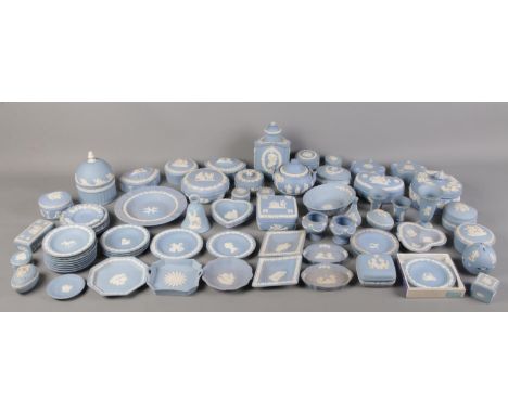 A large quantity of blue Wedgwood jasperware. Including trinket boxes, plate, vases, lidded jar, etc.  