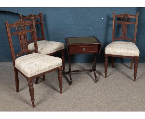 Three Victorian mahogany chairs, with spindle back, carved splat and turned front feet, together with a lyre support sofa tab