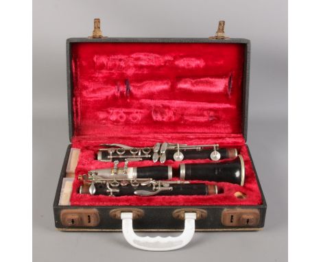 A cased four-piece Boosey &amp; Hawkes Edgware clarinet, with extra reeds.  