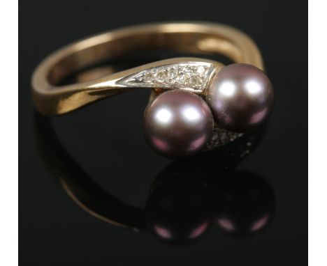 A 9ct gold cultured pearl and diamond ring. Size P. 3.39g.  