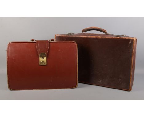 A vintage leather suitcase &amp; briefcase. Suitcase: H: 33cm W:55cm D:13cm.  