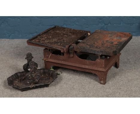 A large set of iron scales, produced by W&amp;T Avery, Birmingham together with a small boot scraper.  