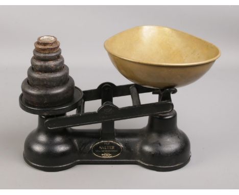 A set of Salter weighing scales, together with graduated weights 1oz-2lb.  