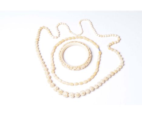 A collection of ivory beads 
Together with an ivory bangle (Qty)