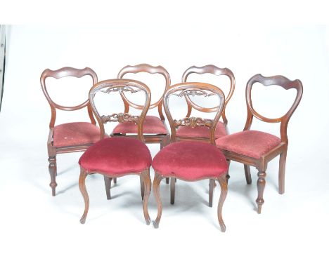 Four Victorian mahogany balloon back dining chairs and two similar chairs
The balloon back chairs raised on baluster ring tur