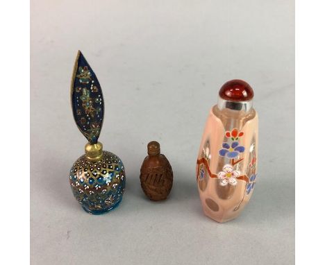 LATE NINETEENTH CENTURY CHINESE ENAMEL SNUFF BOTTLE, with floral decoration; along with another snuff bottle carved from a nu