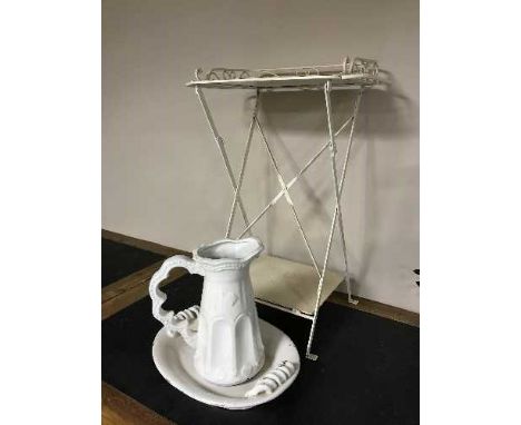 A pottery jug and basin and a metal folding wash stand 