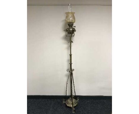 A Victorian rise and fall standard oil lamp with glass shade and chimney 