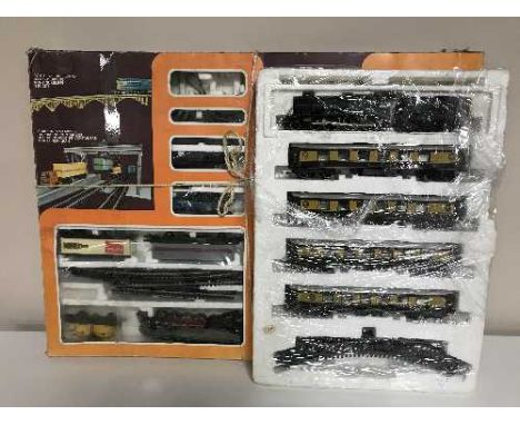 A boxed Lima HO scale banked bridge train set and Great Western locomotive and Pullman coaches 