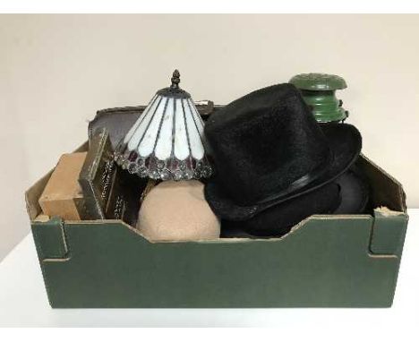 A box of leather satchel, top hats, lady's vintage hats, metal tilley lamp, Tiffany style lamp and shade etc 