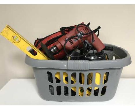 Two baskets of power tools, spirit levels, extension leads, measures etc 