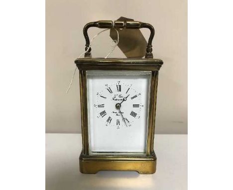 A French brass carriage clock with key 
