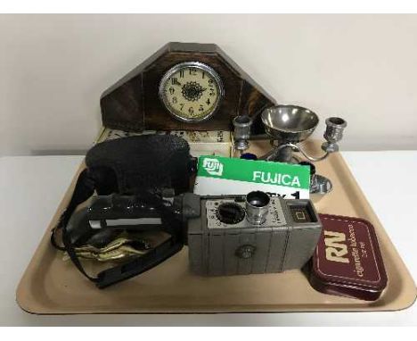 A tray of collectables including a ship-style cruet set, legs nutcrackers, pewter hip flask, Bell & Howell 8mm camera, Fujica