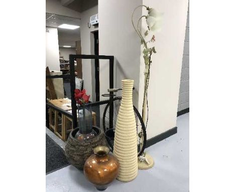 A metal standard lamp with glass shades, metal plant holder, penny farthing, thee vases and a planter 