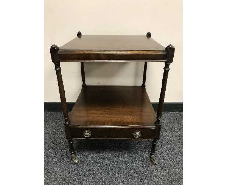 A Regency style mahogany two tier lamp table 