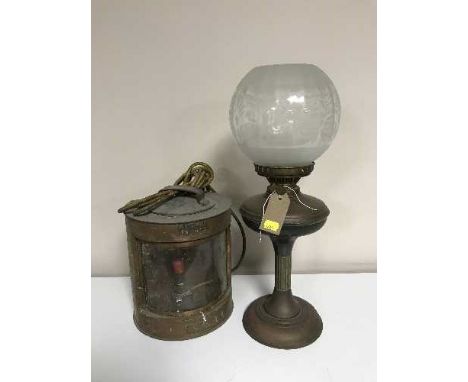 A copper meteorite ship's lamp and a copper oil lamp with glass shade 