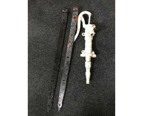 A cast metal water pump and a pair of cast iron gate clasps 