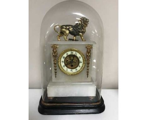 An alabaster and gilt metal mounted mantel clock, under Victorian glass dome on ebonised base with key 