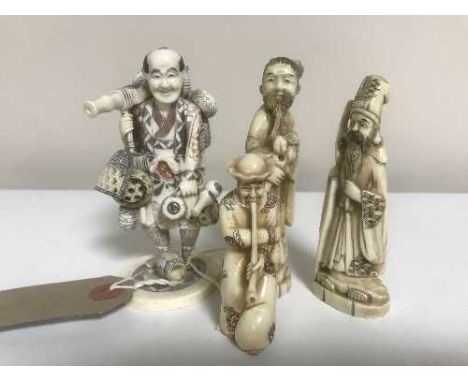 A Japanese netsuke - Gentleman with pipe, together with three further carved figures. (4)