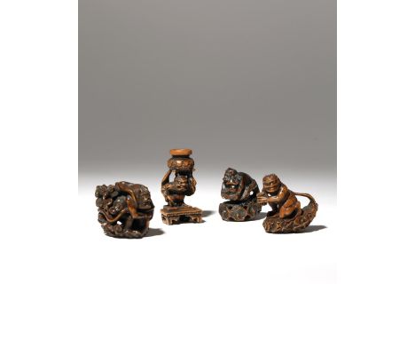 FOUR JAPANESE WOOD NETSUKE OF DEITIES MEIJI PERIOD, 19TH CENTURY Two depicting Raijin, the God of Thunder standing on scrolli