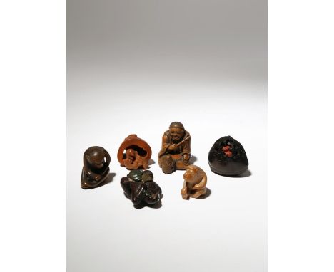 SIX JAPANESE WOOD NETSUKE OF MONKEYS EDO PERIOD AND LATER, 19TH CENTURY One a small red pottery primate in a giant wood chest