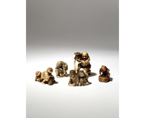 FIVE JAPANESE IVORY NETSUKE MEIJI PERIOD, 19TH CENTURY One large okimono­-style netsuke carved as Tentoki ­holding a lantern;