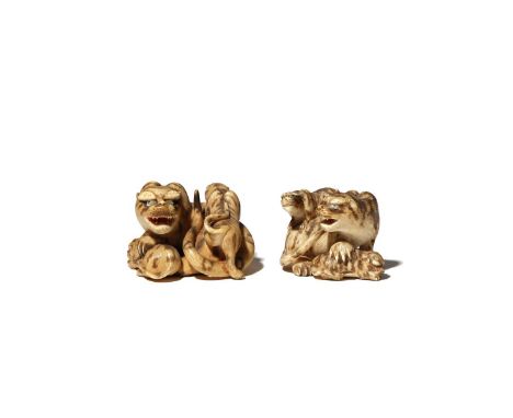 TWO JAPANESE IVORY NETSUKE OF TIGERS MEIJI PERIOD, 19TH CENTURY Both carved as a larger feline and its two young, realistical