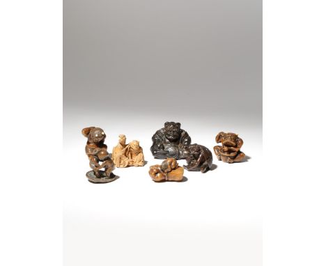 SEVEN JAPANESE WOOD NETSUKE OF ONI EDO AND MEIJI PERIOD, 18TH AND 19TH CENTURY Two depicting the demons on Setsubun as beans 