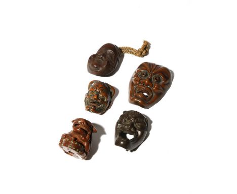 FOUR JAPANESE MASK NETSUKE MEIJI PERIOD, 19TH CENTURY Two in metal and two in wood, variously depicting Okame, Hannya and oth