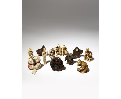 ELEVEN JAPANESE WOOD, LACQUER AND IVORY NETSUKE MEIJI PERIOD, 19TH CENTURY Variously depicting entertainers, itinerant manzai