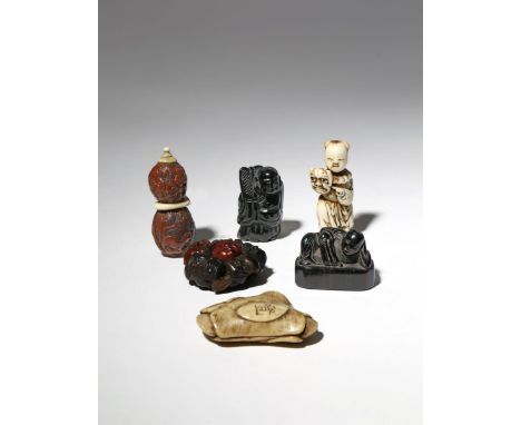 SIX JAPANESE NETSUKE EDO PERIOD AND LATER, 18TH CENTURY AND LATER Two in stag antler, one carved as a small boy holding the m